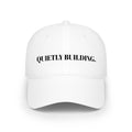 "QUIETLY BUILDING." Hat